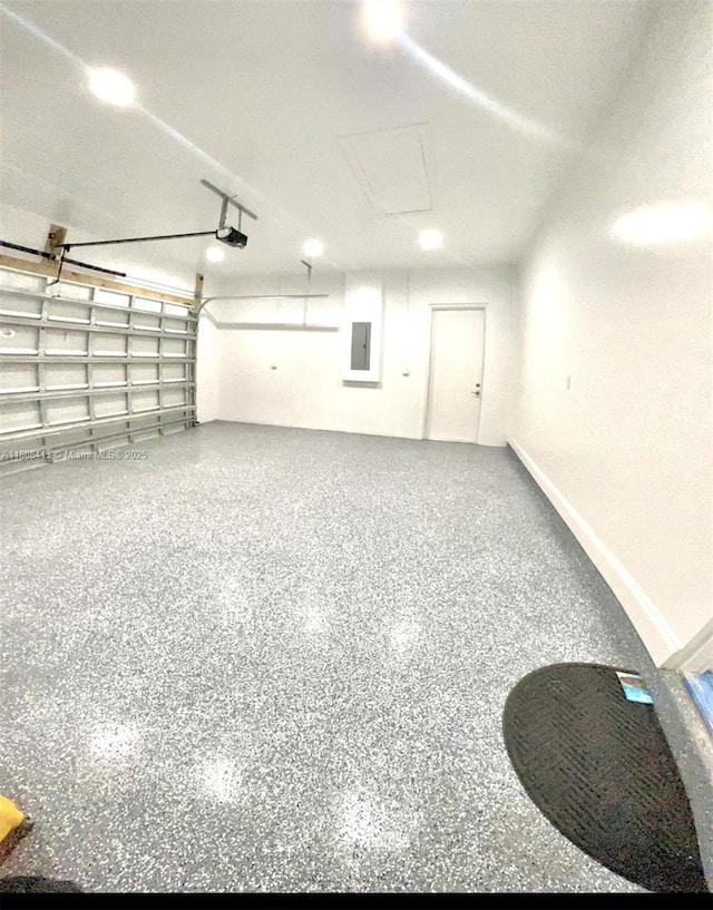 1013 SW Deauville Ave, Port St Lucie, FL 34953 - garage featuring electric panel and a garage door opener