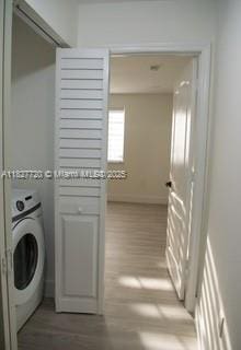 972 N 18th Ct, Hollywood, FL 33020 - laundry room with washer / dryer and light wood-style flooring