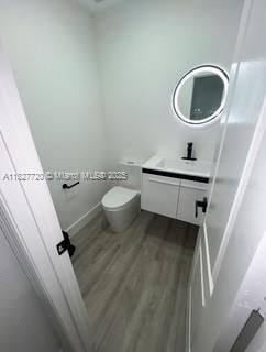 972 N 18th Ct, Hollywood, FL 33020 - bathroom with vanity and wood finished floors