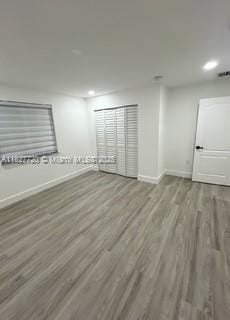 972 N 18th Ct, Hollywood, FL 33020 - empty room with wood finished floors and recessed lighting