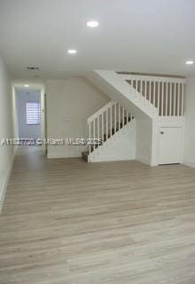 972 N 18th Ct, Hollywood, FL 33020 - additional living space featuring wood finished floors, stairway, and recessed lighting