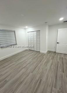 964 N 18th Ct, Hollywood, FL 33020 - empty room featuring wood finished floors and recessed lighting