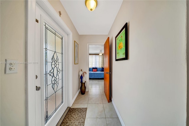 1315 W 79th St, Hialeah, FL 33014 - corridor with light tile patterned flooring and baseboards