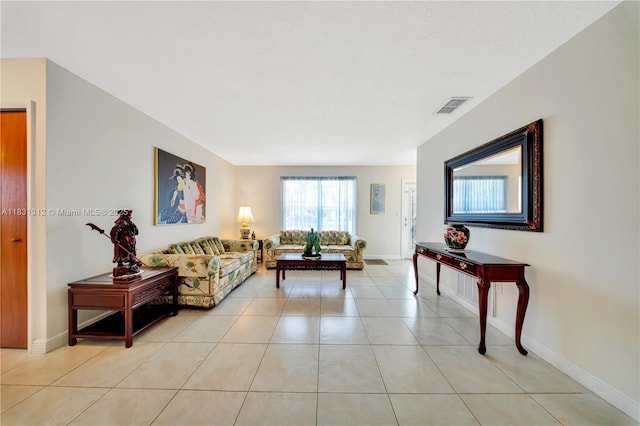 1315 W 79th St, Hialeah, FL 33014 - living area featuring light tile patterned flooring and baseboards