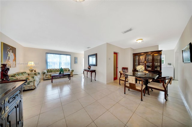 1315 W 79th St, Hialeah, FL 33014 - dining space featuring light tile patterned floors and baseboards