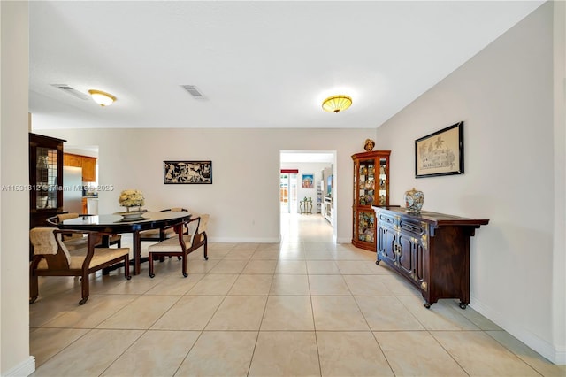 1315 W 79th St, Hialeah, FL 33014 - dining room featuring light tile patterned floors and baseboards