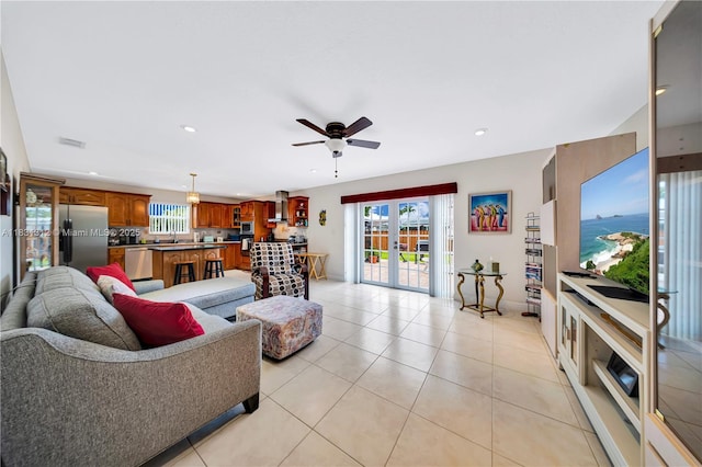 1315 W 79th St, Hialeah, FL 33014 - living room with french doors, a ceiling fan, healthy amount of natural light, light tile patterned floors, and recessed lighting