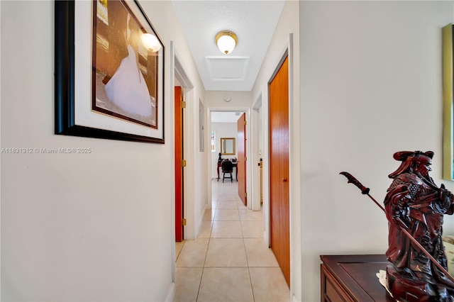 1315 W 79th St, Hialeah, FL 33014 - hallway featuring light tile patterned flooring and baseboards