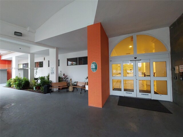 1351 NE Miami Gardens Dr Unit 513E, Miami, FL 33179 - view of exterior entry featuring french doors