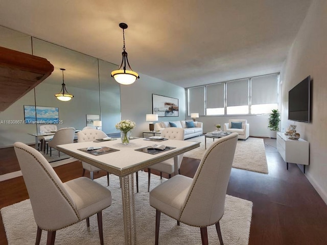 1351 NE Miami Gardens Dr Unit 513E, Miami, FL 33179 - dining space featuring wood finished floors and baseboards