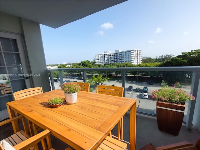 1351 NE Miami Gardens Dr Unit 513E, Miami, FL 33179 - balcony featuring outdoor dining space