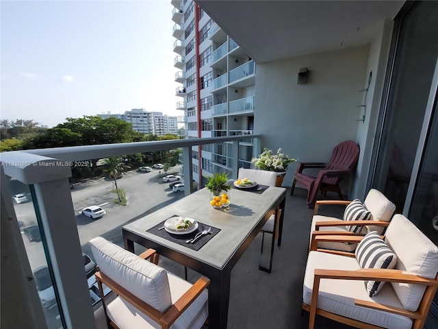 1351 NE Miami Gardens Dr Unit 513E, Miami, FL 33179 - balcony featuring an outdoor living space