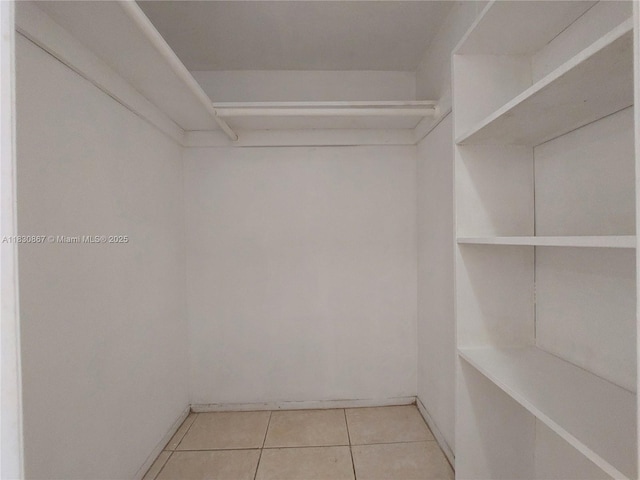 1351 NE Miami Gardens Dr Unit 513E, Miami, FL 33179 - spacious closet featuring light tile patterned flooring