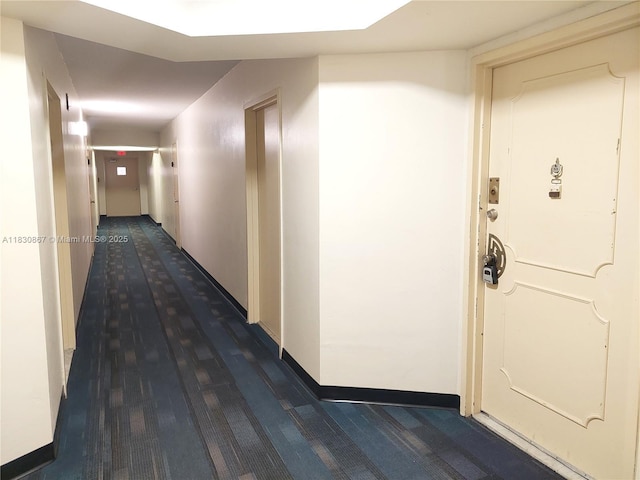1351 NE Miami Gardens Dr Unit 513E, Miami, FL 33179 - hall featuring dark colored carpet and baseboards