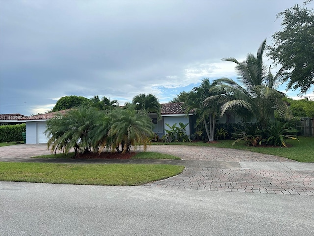 8821 SW 87th St, Miami, FL 33173 - obstructed view of property with curved driveway