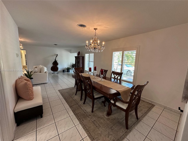 8821 SW 87th St, Miami, FL 33173 - dining space featuring a chandelier and light tile patterned floors