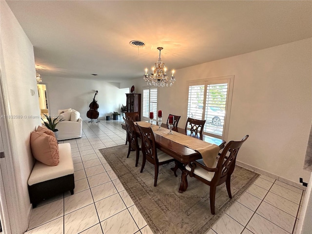 8821 SW 87th St, Miami, FL 33173 - dining space with light tile patterned floors and a chandelier