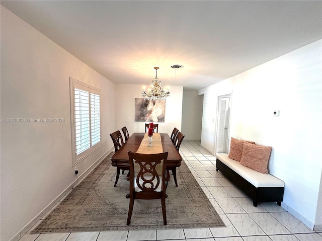 8821 SW 87th St, Miami, FL 33173 - dining area featuring a chandelier and light tile patterned floors