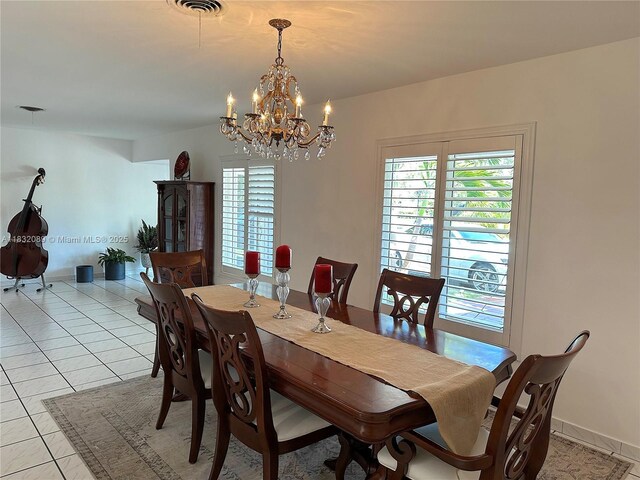 8821 SW 87th St, Miami, FL 33173 - dining area with a chandelier and light tile patterned floors