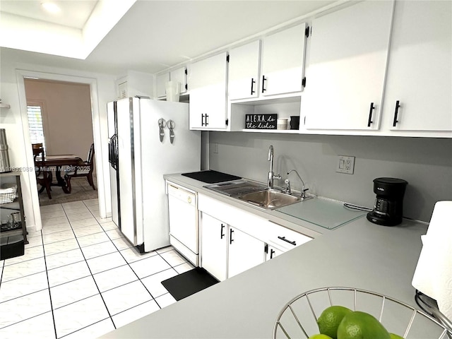 8821 SW 87th St, Miami, FL 33173 - kitchen with white appliances, light countertops, white cabinetry, open shelves, and light tile patterned floors