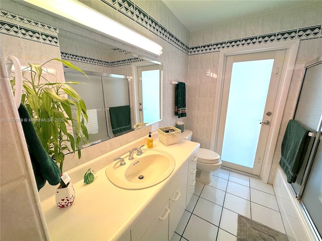 8821 SW 87th St, Miami, FL 33173 - full bathroom with tile patterned flooring, vanity, a shower with shower door, and tile walls