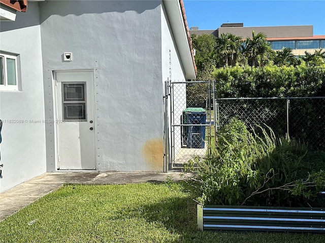 8821 SW 87th St, Miami, FL 33173 - view of home's exterior featuring a gate and stucco siding