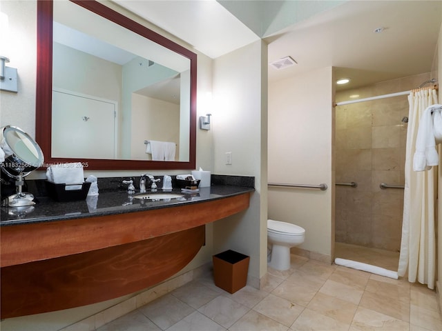 18001 Collins Ave Unit 1107, Sunny Isles Beach, FL 33160 - bathroom with tiled shower, vanity, and tile patterned flooring