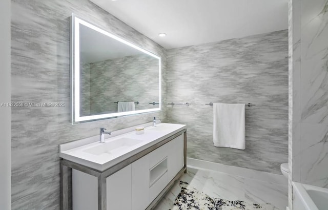 2000 Metropica Way Unit 2102, Sunrise, FL 33323 - full bath featuring double vanity, marble finish flooring, and a tub to relax in