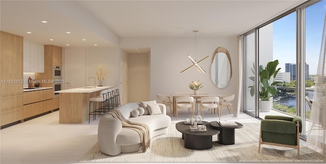 501 SE 6th Ave Unit 611, Fort Lauderdale, FL 33301 - living room with expansive windows, recessed lighting, and a city view