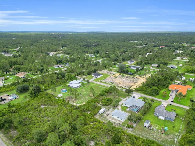 1018 Calvin Ave, Lehigh Acres, FL 33972 - aerial view of property's location with a forest and nearby suburban area