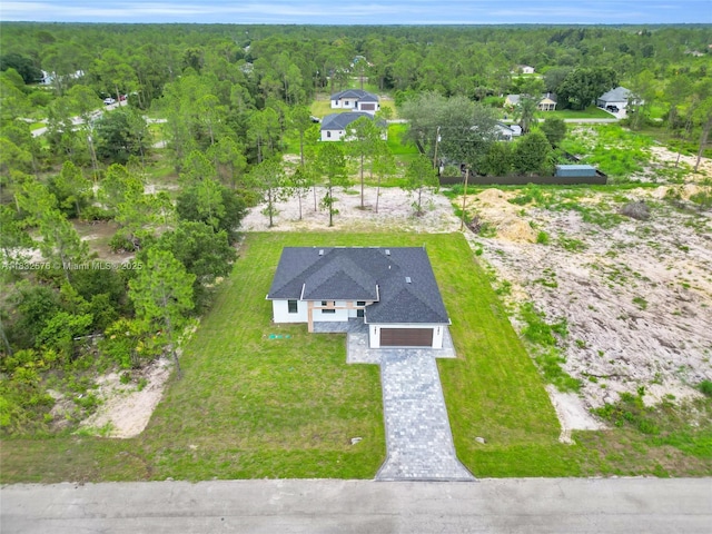 1018 Calvin Ave, Lehigh Acres, FL 33972 - aerial view of property and surrounding area featuring a forest