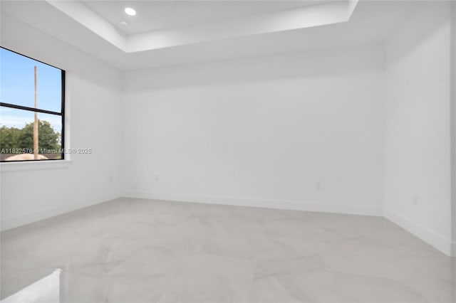 1018 Calvin Ave, Lehigh Acres, FL 33972 - spare room with a raised ceiling, recessed lighting, and light marble finish flooring