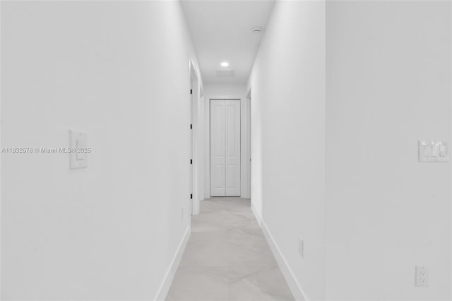 1018 Calvin Ave, Lehigh Acres, FL 33972 - corridor featuring light marble finish flooring and recessed lighting