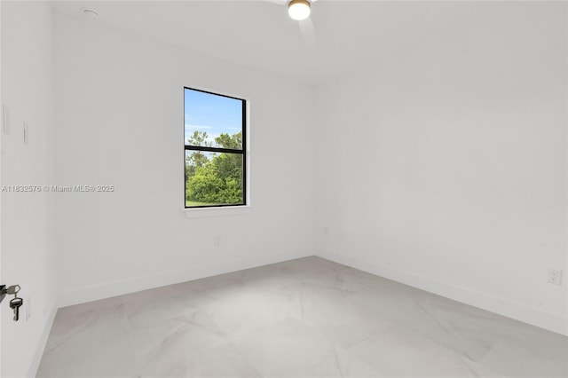 1018 Calvin Ave, Lehigh Acres, FL 33972 - unfurnished room featuring light marble finish floors and baseboards