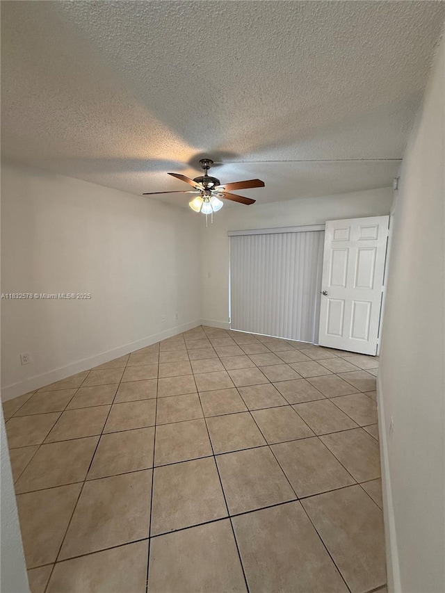 6515 W 27th Ct Unit 49-12, Hialeah, FL 33016 - unfurnished room with ceiling fan, light tile patterned floors, and a textured ceiling