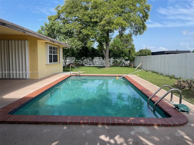 14409 SW 141st Pl, Miami, FL 33186 - view of swimming pool with a fenced backyard