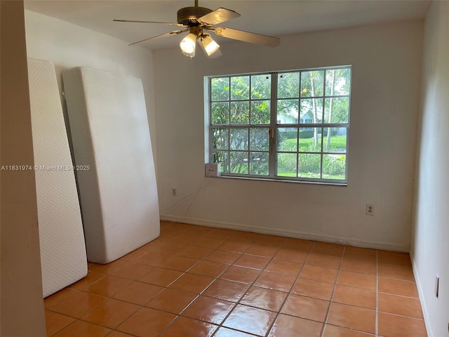 14409 SW 141st Pl, Miami, FL 33186 - unfurnished room featuring light tile patterned flooring and a ceiling fan