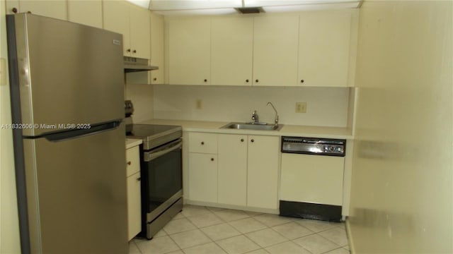 13550 SW 6th Ct Unit 208A, Pembroke Pines, FL 33027 - kitchen featuring stainless steel appliances, under cabinet range hood, light countertops, light tile patterned floors, and white cabinets