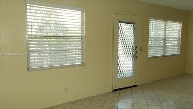 13550 SW 6th Ct Unit 208A, Pembroke Pines, FL 33027 - doorway with light tile patterned floors and healthy amount of natural light