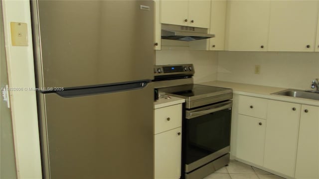 13550 SW 6th Ct Unit 208A, Pembroke Pines, FL 33027 - kitchen featuring appliances with stainless steel finishes, under cabinet range hood, light countertops, and light tile patterned flooring