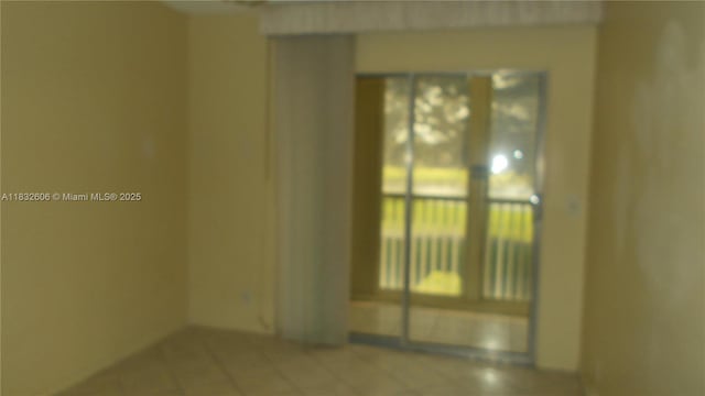 13550 SW 6th Ct Unit 208A, Pembroke Pines, FL 33027 - view of tiled empty room