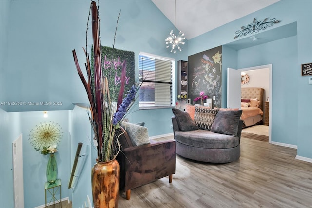 1419 Avon Ln Unit 216, North Lauderdale, FL 33068 - living area with high vaulted ceiling, wood finished floors, and a chandelier