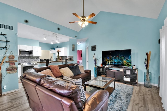 1419 Avon Ln Unit 216, North Lauderdale, FL 33068 - living area featuring wood finished floors, ceiling fan, and high vaulted ceiling