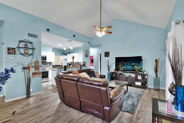 1419 Avon Ln Unit 216, North Lauderdale, FL 33068 - living area featuring lofted ceiling, light wood-style floors, and a ceiling fan