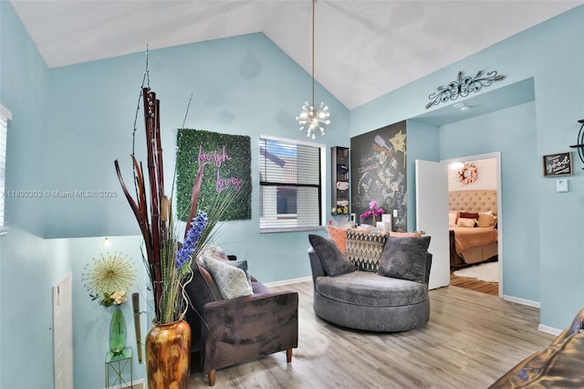 1419 Avon Ln Unit 216, North Lauderdale, FL 33068 - sitting room featuring wood finished floors, a chandelier, and high vaulted ceiling