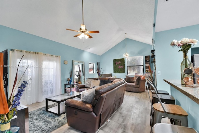 1419 Avon Ln Unit 216, North Lauderdale, FL 33068 - living room with light wood-type flooring, vaulted ceiling, and a ceiling fan