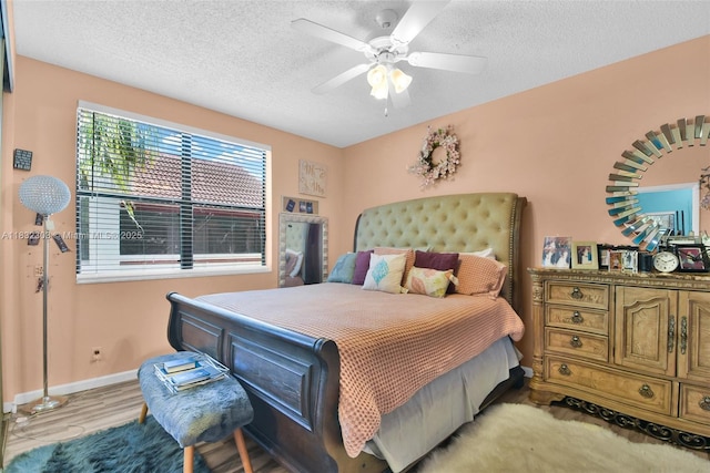 1419 Avon Ln Unit 216, North Lauderdale, FL 33068 - bedroom with a textured ceiling, a ceiling fan, and wood finished floors
