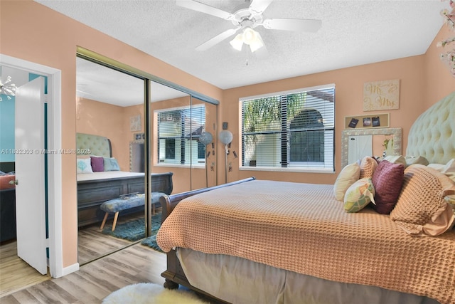 1419 Avon Ln Unit 216, North Lauderdale, FL 33068 - bedroom featuring wood finished floors, a closet, a textured ceiling, and a ceiling fan