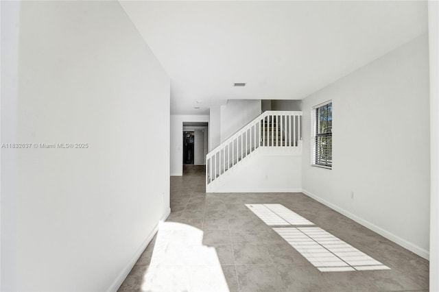 5013 Vulcan Way, Davie, FL 33314 - empty room featuring stairway and tile patterned floors
