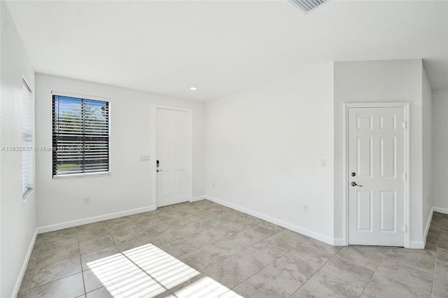 5013 Vulcan Way, Davie, FL 33314 - unfurnished room featuring light tile patterned floors and recessed lighting